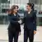 Image where two business ladies shake their hands for the contract in machine learning